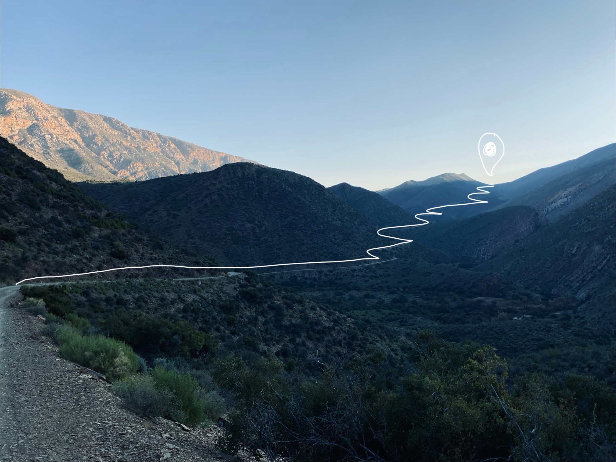 Mountain pass with a path traced through it